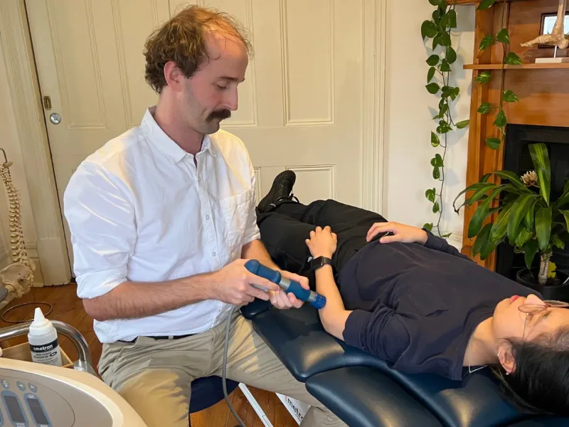 Andrew Macdonald treating a patient