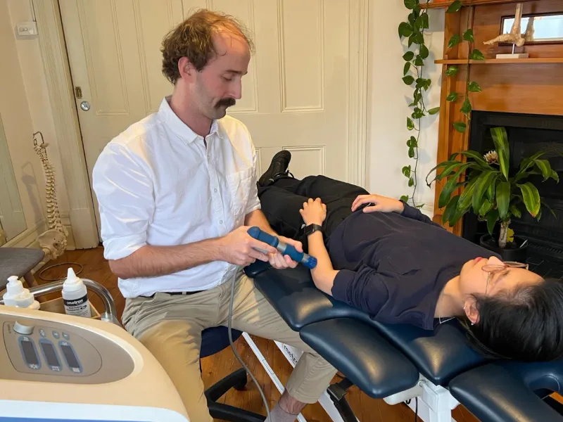 Andrew Macdonald treating a patient
