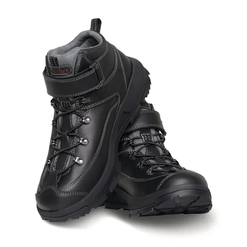 A pair of the Dr. Comfort Yukon in black, one boot turned to show the tongue and the instep strap